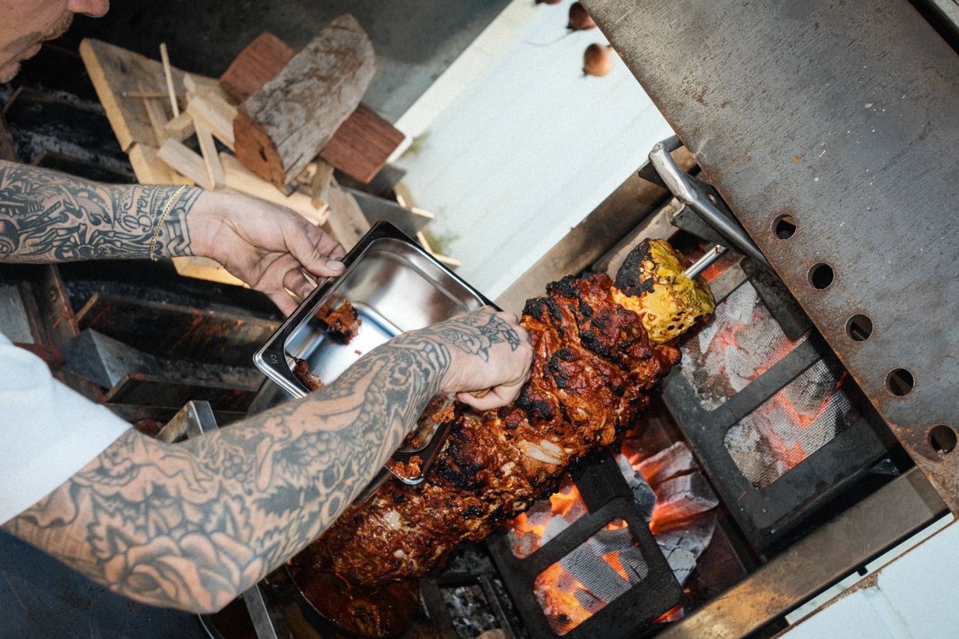 Basting meat over the coals at MULE